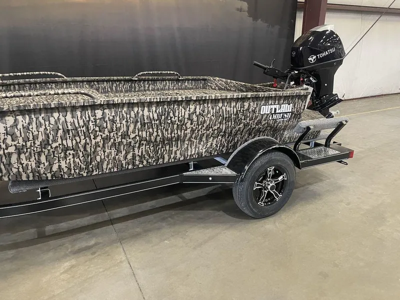 Slide: The Image of 2023 Legend Craft Outlaw 1656 boat with camo design and Tohatsu outboard motor. - 15