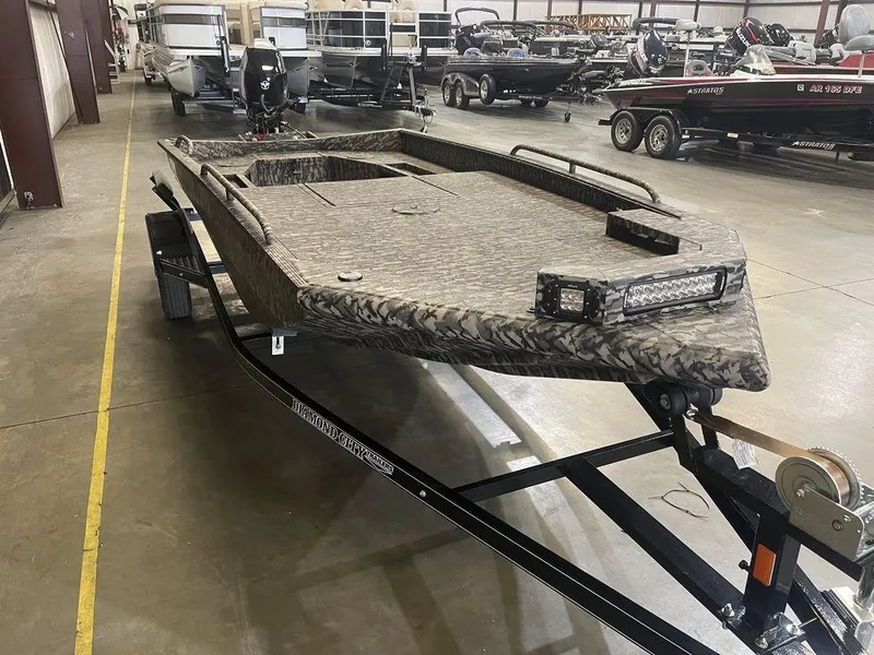 Slide: The Image of 2023 Legend Craft Outlaw 1656 boat on trailer in showroom. - 9