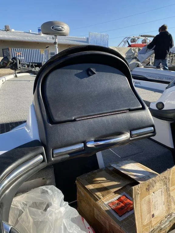 Slide: The Image of 2006 Skeeter Bass Boat dashboard and storage compartment. - 11