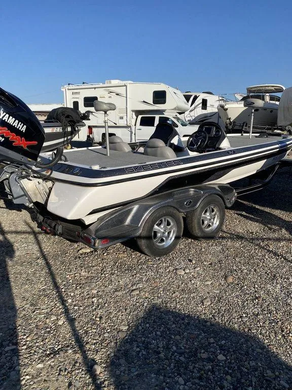 Slide: The Image of 2006 Skeeter Bass Boat with Yamaha engine on trailer in RV lot. - 8