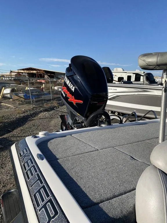 Slide: The Image of 2006 Skeeter Bass Boat with Yamaha engine in a marina. - 9