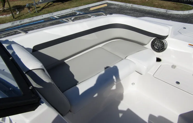 Slide: The Image of 2023 Starcraft SVX 210 OB boat with gray and white seating area. - 10