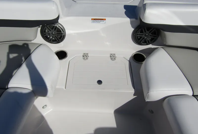 Slide: The Image of 2023 Starcraft SVX 210 OB boat interior seating and storage area. - 11