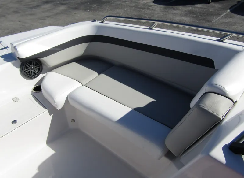 Slide: The Image of 2023 Starcraft SVX 210 OB boat interior seating with gray and white upholstery. - 12