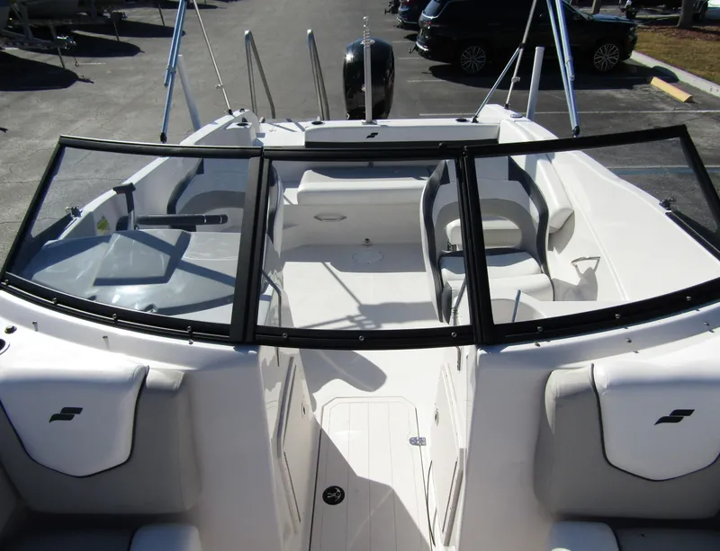 Slide: The Image of 2023 Starcraft SVX 210 OB boat interior with seating and windshield. - 15
