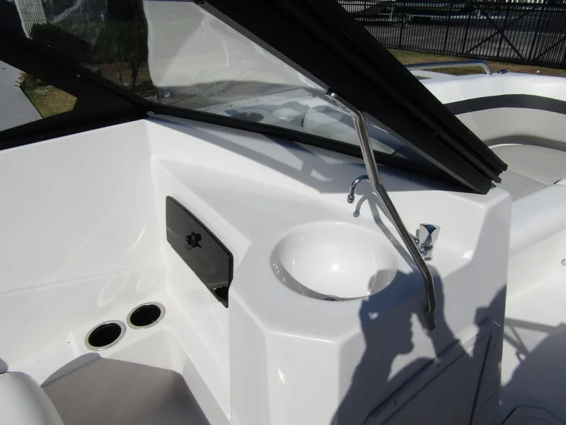Slide: The Image of 2023 Starcraft SVX 210 OB boat interior with sink and storage compartment. - 17