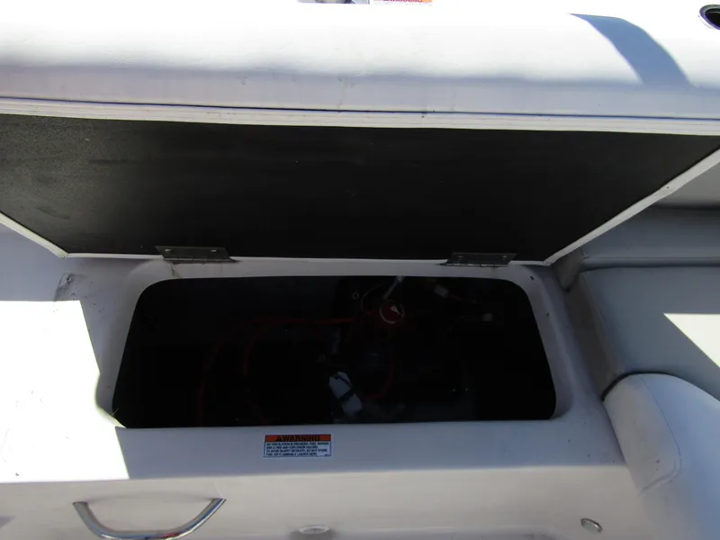 Slide: The Image of Open storage compartment on a 2023 Starcraft SVX 210 OB boat. - 26