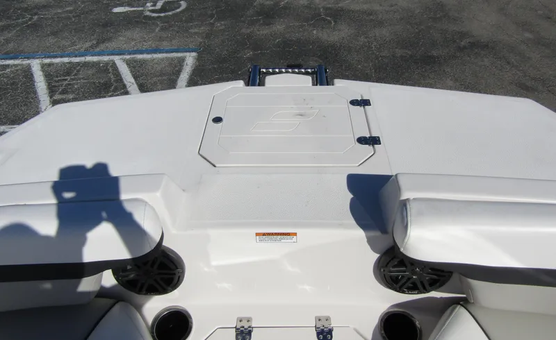 Slide: The Image of 2023 Starcraft SVX 210 OB boat deck with storage compartment and speakers. - 7
