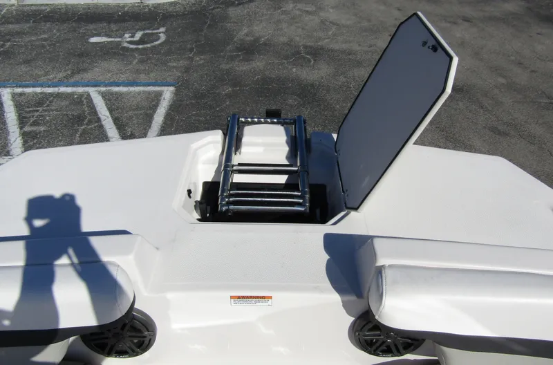 Slide: The Image of 2023 Starcraft SVX 210 OB boat with open hatch and ladder. - 8