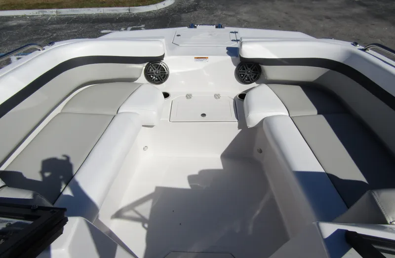 Slide: The Image of 2023 Starcraft SVX 210 OB boat interior with spacious seating and built-in speakers. - 9