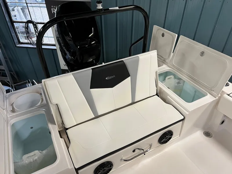 Slide: The Image of 2023 Robalo 266 Cayman boat interior with seating and storage compartments. - 15