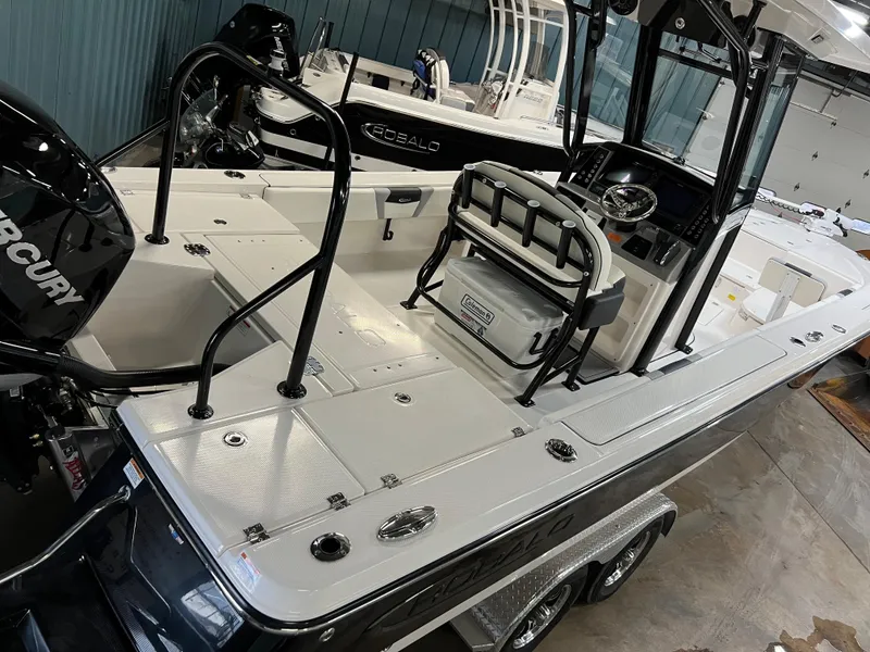 Slide: The Image of 2023 Robalo 266 Cayman boat with Mercury engine in a showroom. - 6
