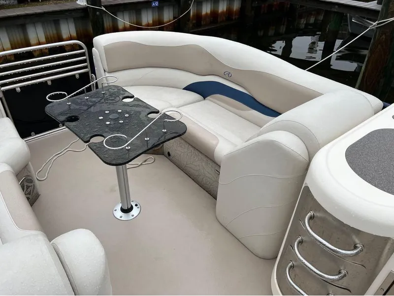 Slide: The Image of 2013 Avalon AMBASSADOR 2785 ENTERTAINER boat interior with seating and table. - 10