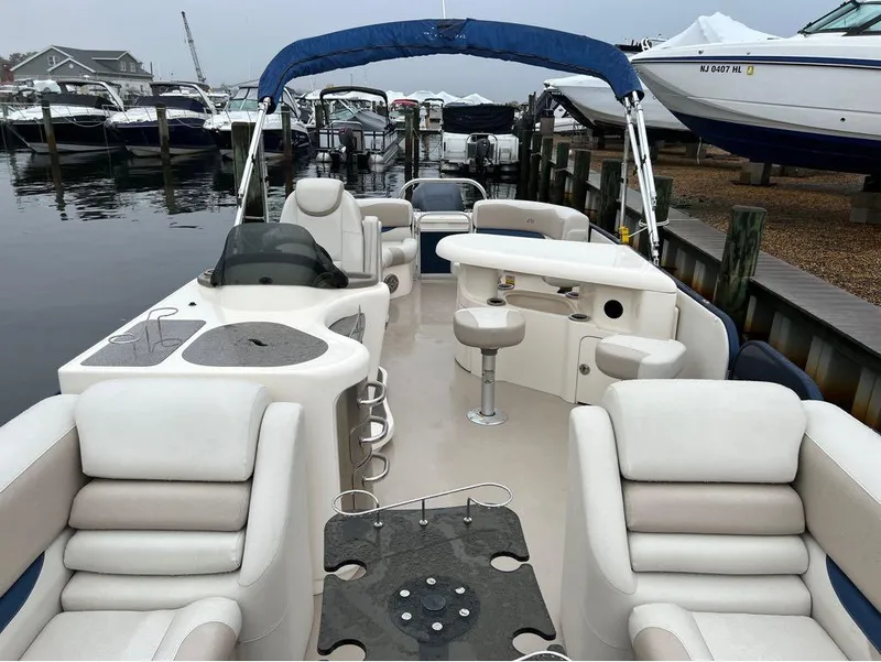 Slide: The Image of 2013 Avalon AMBASSADOR 2785 ENTERTAINER pontoon boat docked at a marina. - 20