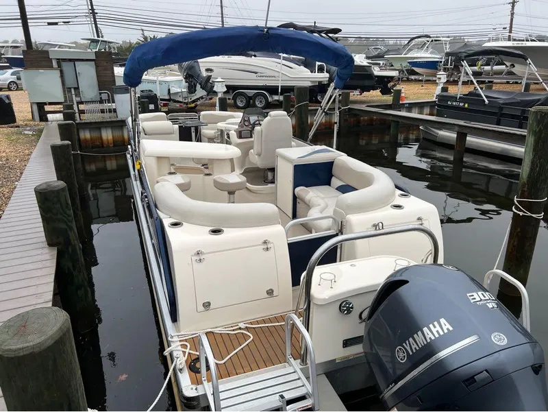 Slide: The Image of 2013 Avalon AMBASSADOR 2785 ENTERTAINER pontoon boat docked, featuring Yamaha 300 outboard motor. - 22