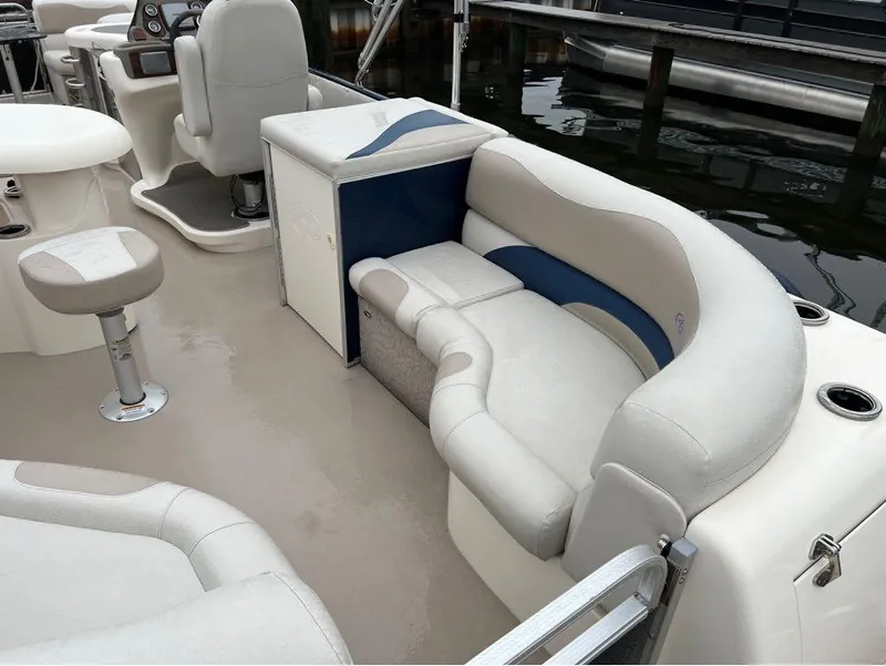 Slide: The Image of 2013 Avalon AMBASSADOR 2785 ENTERTAINER boat interior with seating and helm station. - 23