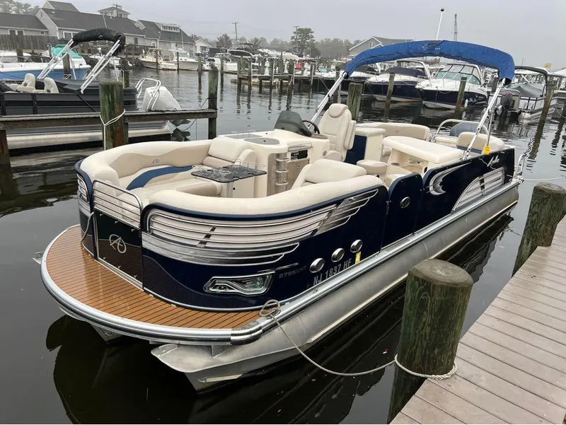 Slide: The Image of 2013 Avalon AMBASSADOR 2785 ENTERTAINER pontoon boat docked at a marina. - 5