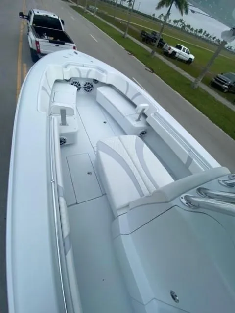 Slide: The Image of 2025 Contender 35 ST boat on trailer, sleek design, parked near waterfront. - 5