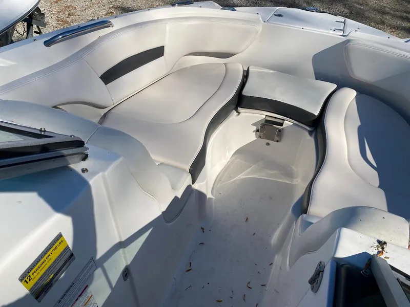 Slide: The Image of 2016 Chaparral 224 Sunesta boat interior with white and black seating. - 11