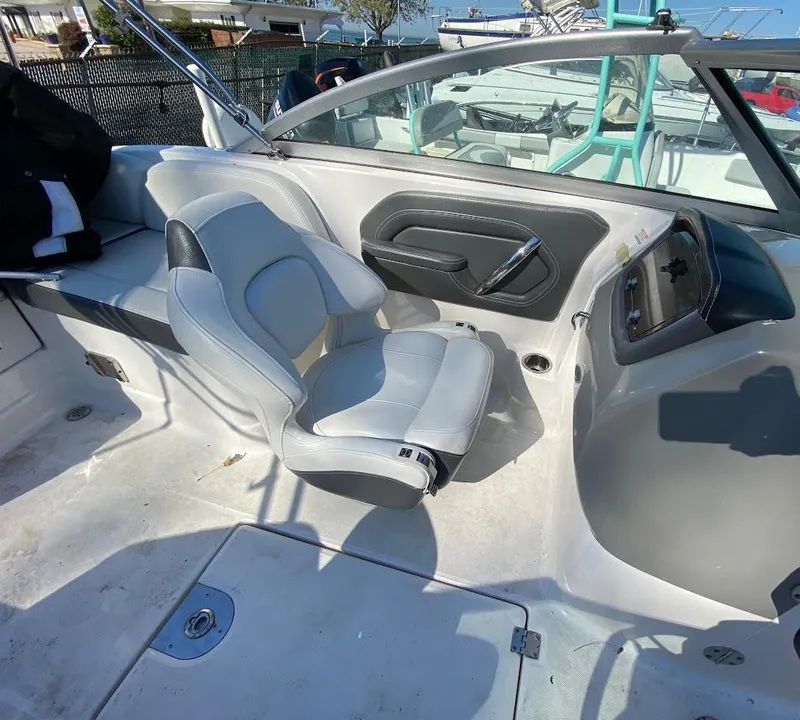 Slide: The Image of 2016 Chaparral 224 Sunesta boat interior with captain's chair and dashboard. - 13