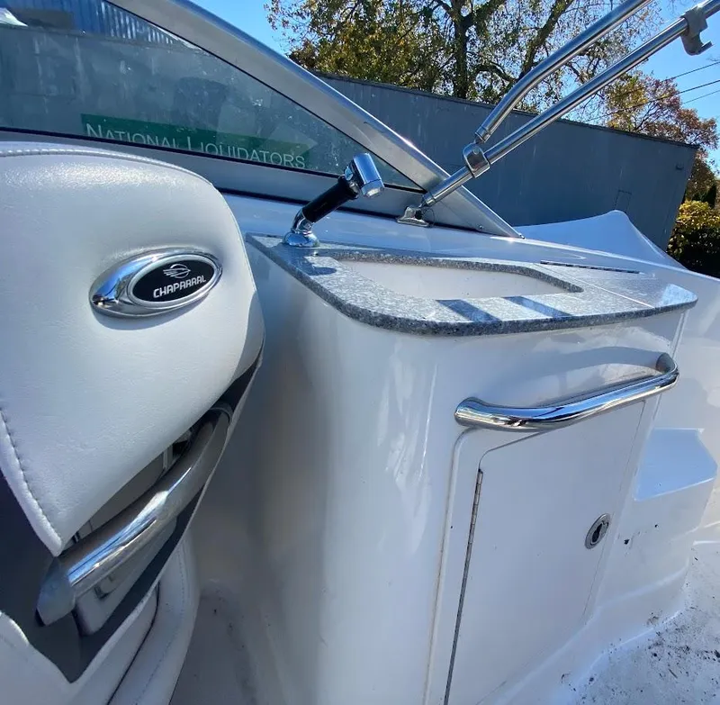 Slide: The Image of 2016 Chaparral 224 Sunesta boat interior with steering console and control panel. - 14