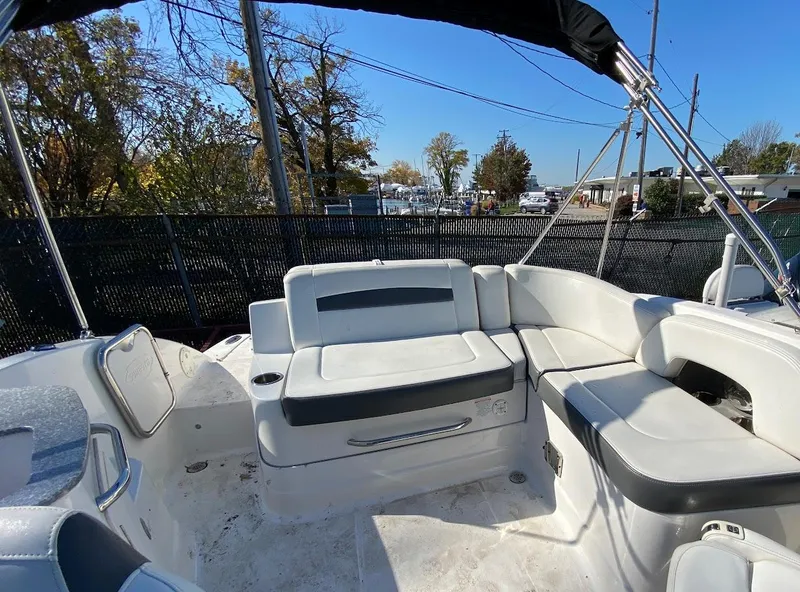 Slide: The Image of 2016 Chaparral 224 Sunesta boat interior with white and gray seating. - 20