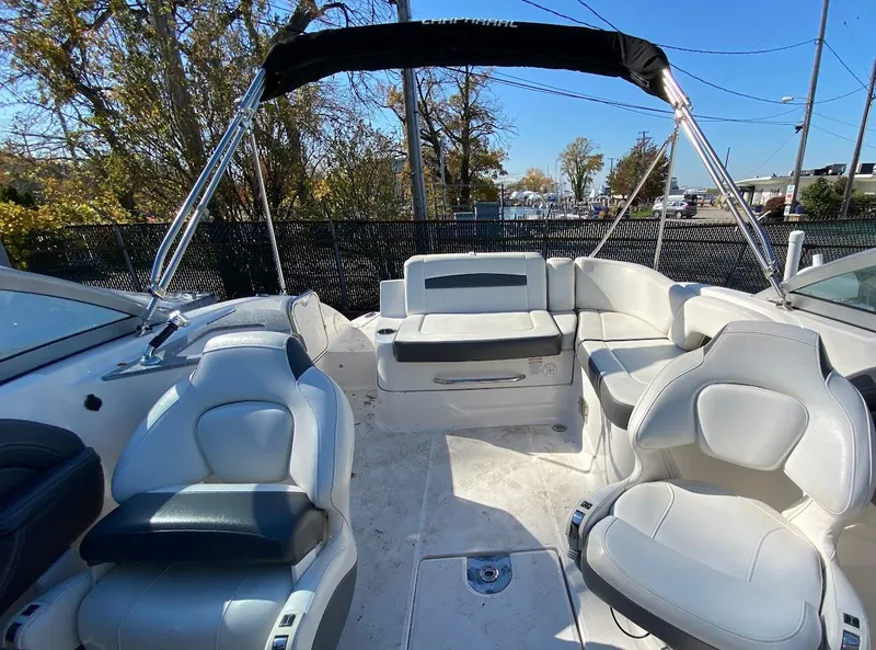 Slide: The Image of 2016 Chaparral 224 Sunesta boat interior with white and gray seating. - 21