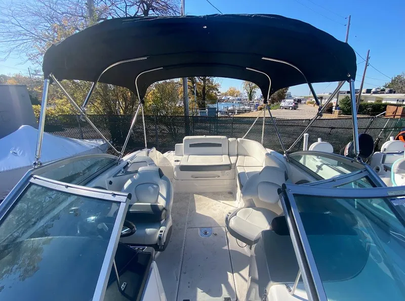 Slide: The Image of 2016 Chaparral 224 Sunesta boat interior with canopy and seating. - 22