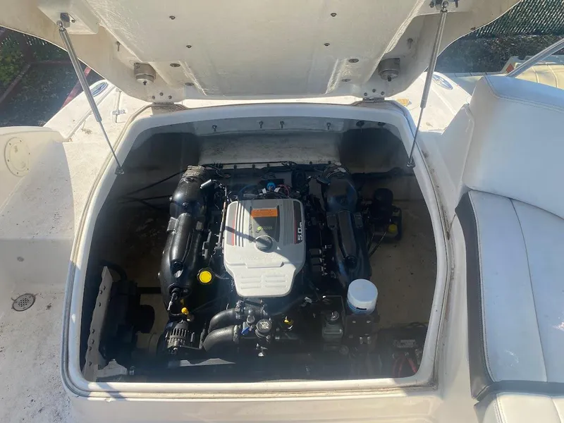 Slide: The Image of 2016 Chaparral 224 Sunesta boat engine compartment with open hatch. - 24