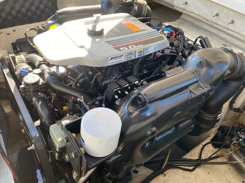 Slide: The Image of 2016 Chaparral 224 Sunesta boat engine compartment with 5.0L Mercury engine. - 32
