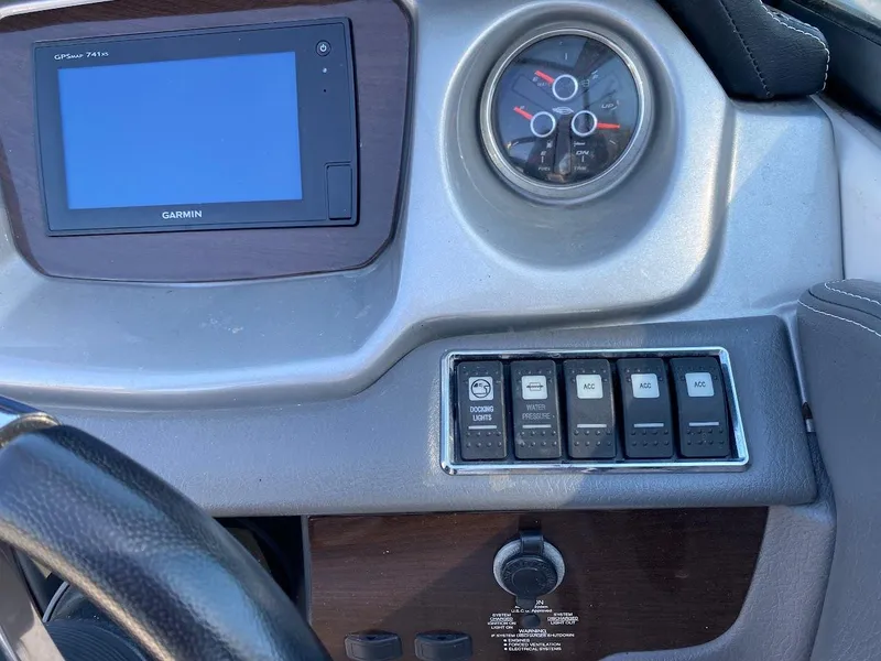 Slide: The Image of Control panel of a 2016 Chaparral 224 Sunesta boat with Garmin display. - 8