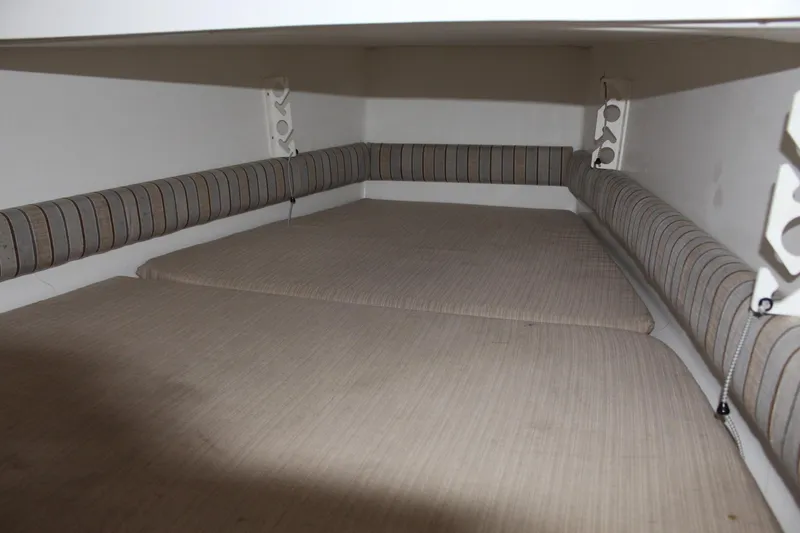 Slide: The Image of Interior cabin of 2014 Regulator 34 SS boat with cushioned seating. - 20