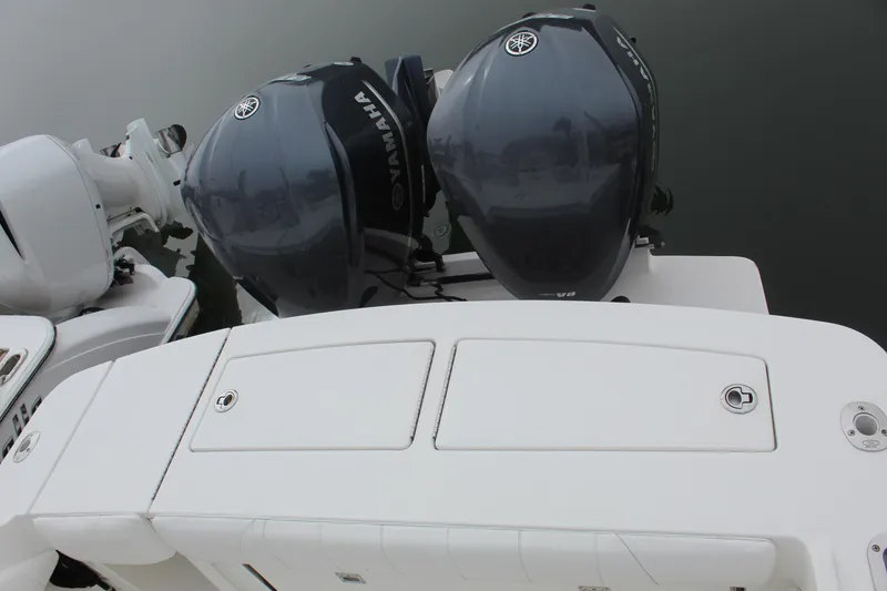 Slide: The Image of 2014 Regulator 34 SS boat with twin Yamaha outboard engines. - 37
