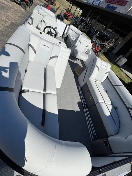 Slide: The Image of 2023 Crest Classic LX 220 SLC pontoon boat with spacious seating and modern design. - 13