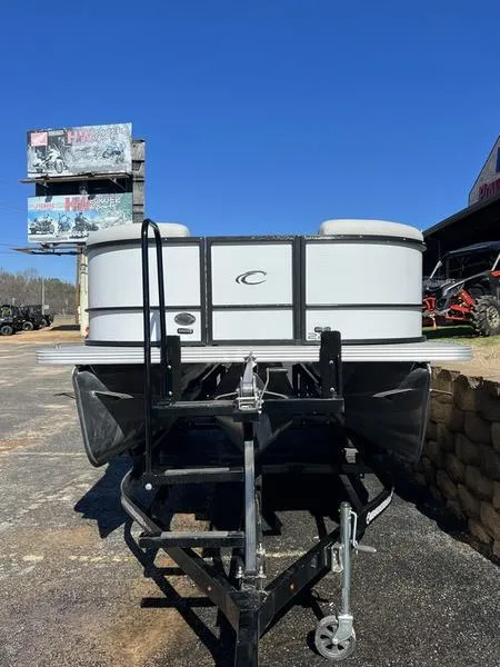 Slide: The Image of 2023 Crest Classic LX 220 SLC pontoon boat on trailer, front view. - 14