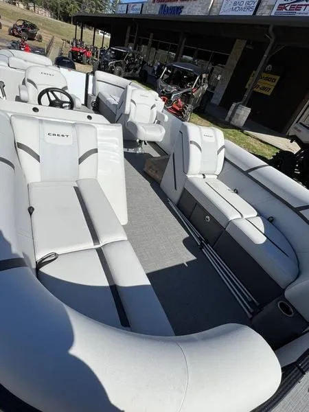 Slide: The Image of 2023 Crest Classic LX 220 SLC pontoon boat with spacious seating and modern design. - 5