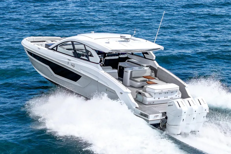 Slide: The Image of 2024 Cruisers Yachts 50 GLS luxury motor yacht cruising on open water. - 10