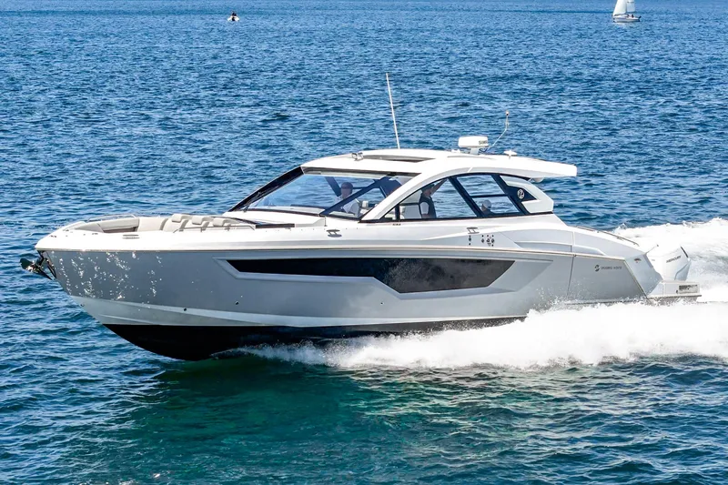 Slide: The Image of 2024 Cruisers Yachts 50 GLS luxury motor yacht cruising on open water. - 8