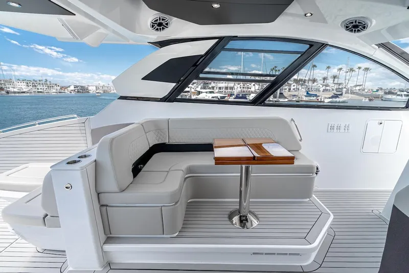 Slide: The Image of 2024 Cruisers Yachts 50 GLS luxury seating area with ocean view. - 40