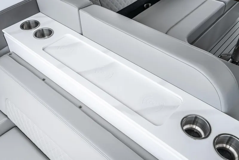 Slide: The Image of Luxury seating with cup holders on the 2024 Cruisers Yachts 50 GLS. - 47
