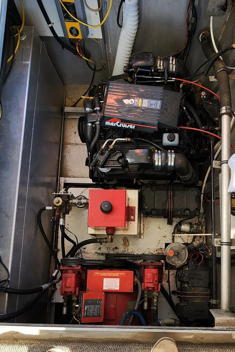 Slide: The Image of Engine compartment of a 1996 Sunstar 16x78 houseboat with MerCruiser engine. - 21