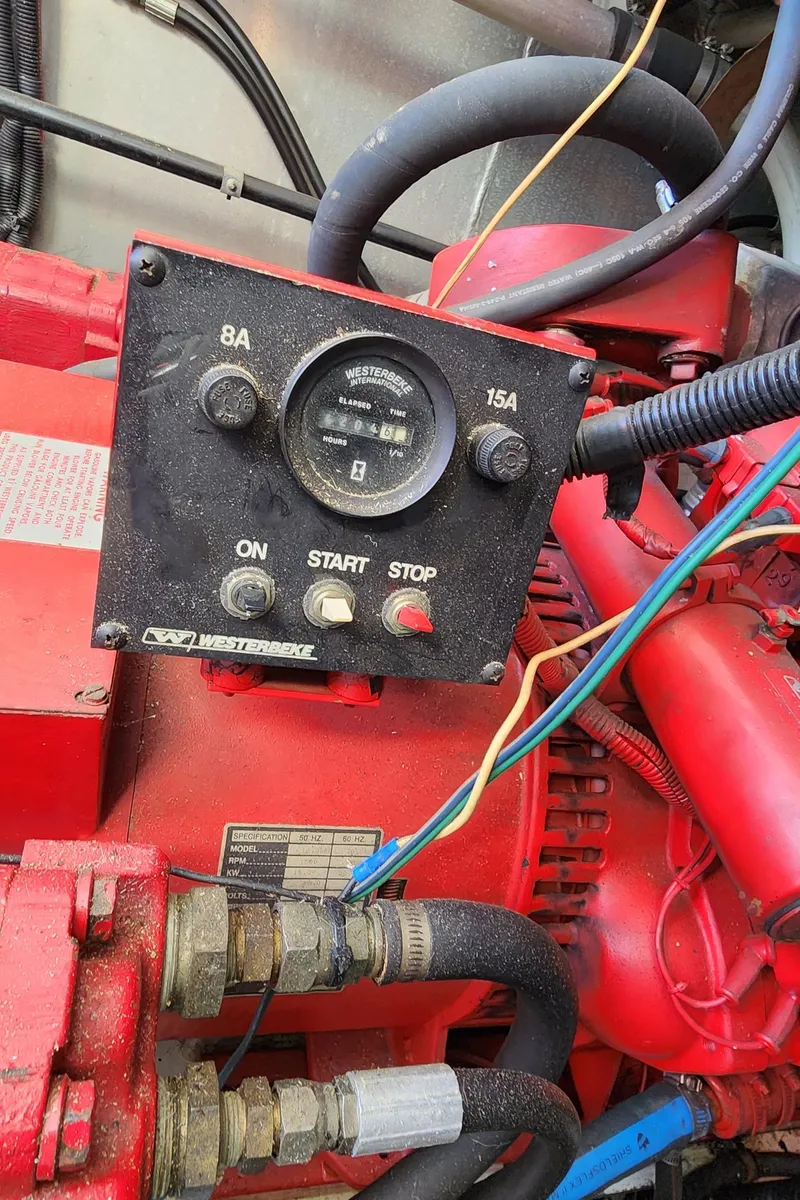 Slide: The Image of 1996 Sunstar 16x78 engine control panel with start/stop buttons and gauges. - 22