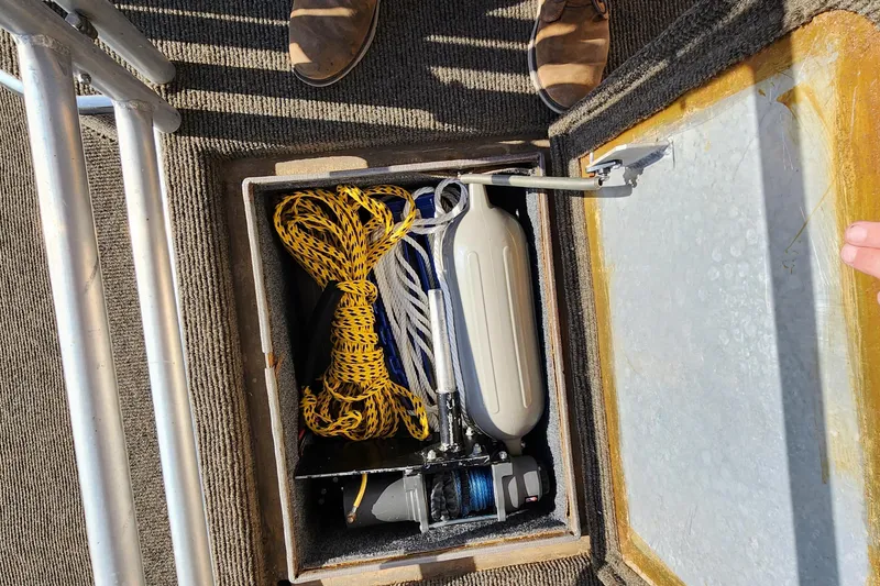 Slide: The Image of Storage compartment on a 1996 Sunstar 16x78 houseboat with boating equipment. - 24