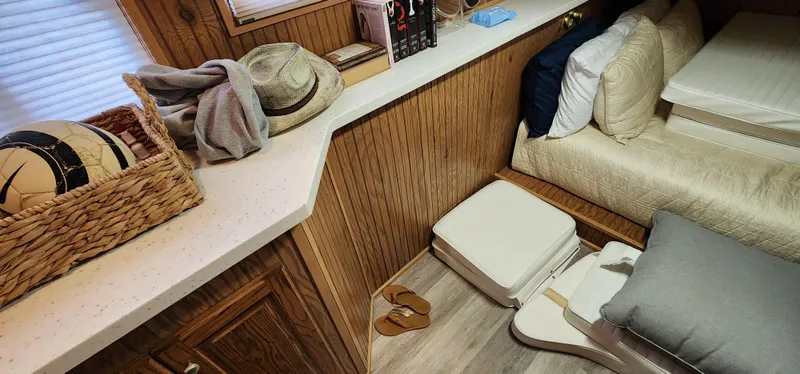 Slide: The Image of Interior of a 1996 Sunstar 16x78 houseboat with cozy bedroom and storage. - 41
