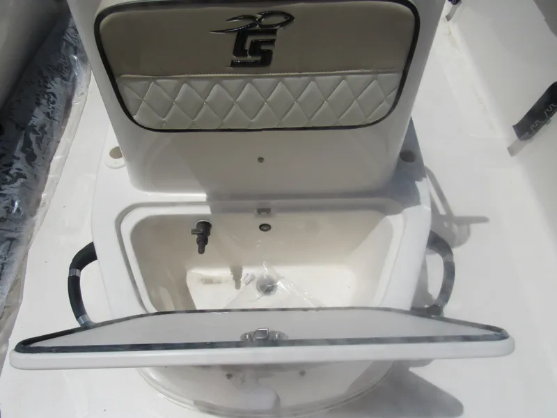Slide: The Image of Open storage compartment on a 2022 Carolina Skiff 21 LS boat. - 10