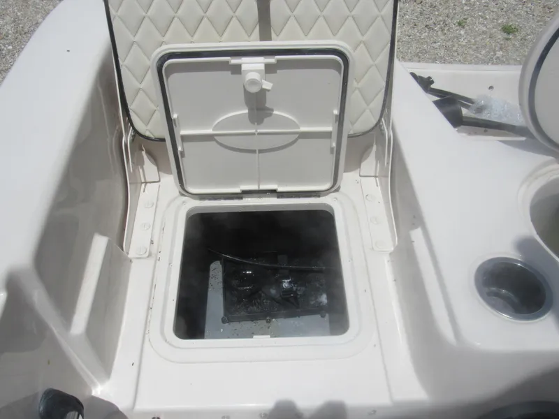 Slide: The Image of Open storage compartment on a 2022 Carolina Skiff 21 LS boat. - 12
