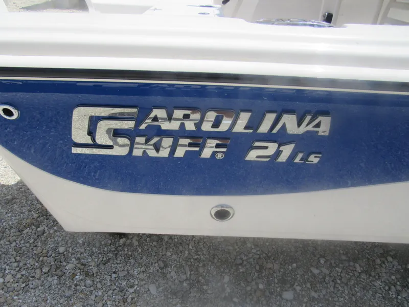 Slide: The Image of 2022 Carolina Skiff 21 LS boat logo on blue and white hull. - 16