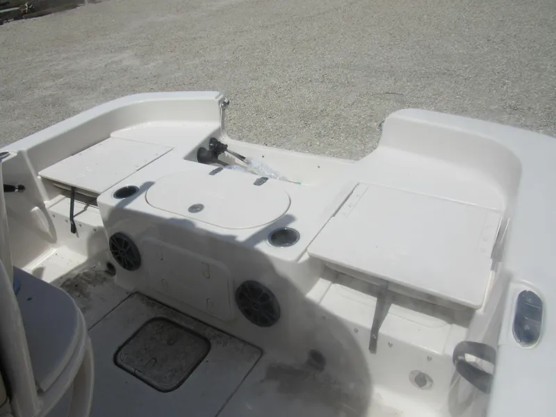 Slide: The Image of 2022 Carolina Skiff 21 LS boat interior with storage compartments and seating. - 22