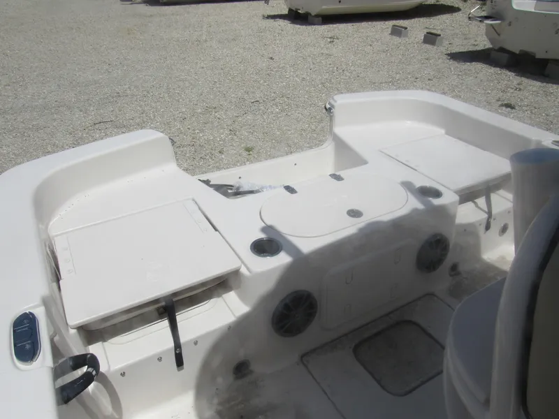 Slide: The Image of 2022 Carolina Skiff 21 LS boat interior with seating and storage compartments. - 23
