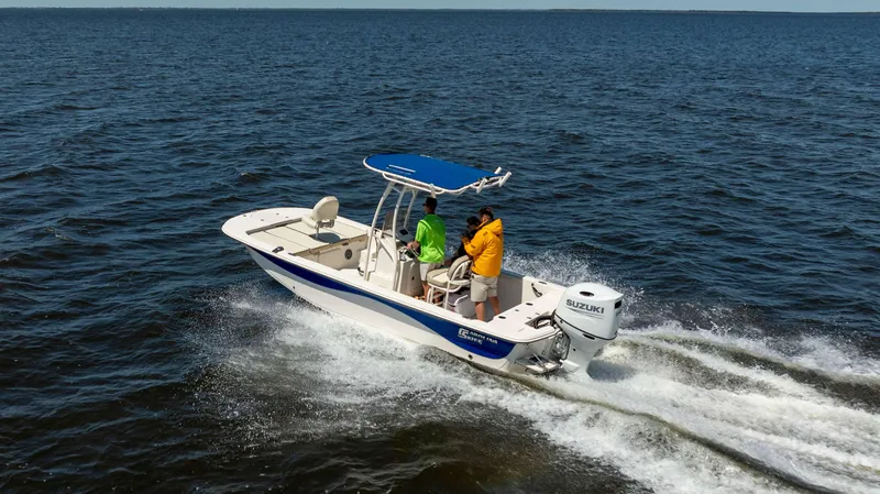 Slide: The Image of 2022 Carolina Skiff 21 LS boat cruising on open water with passengers. - 3